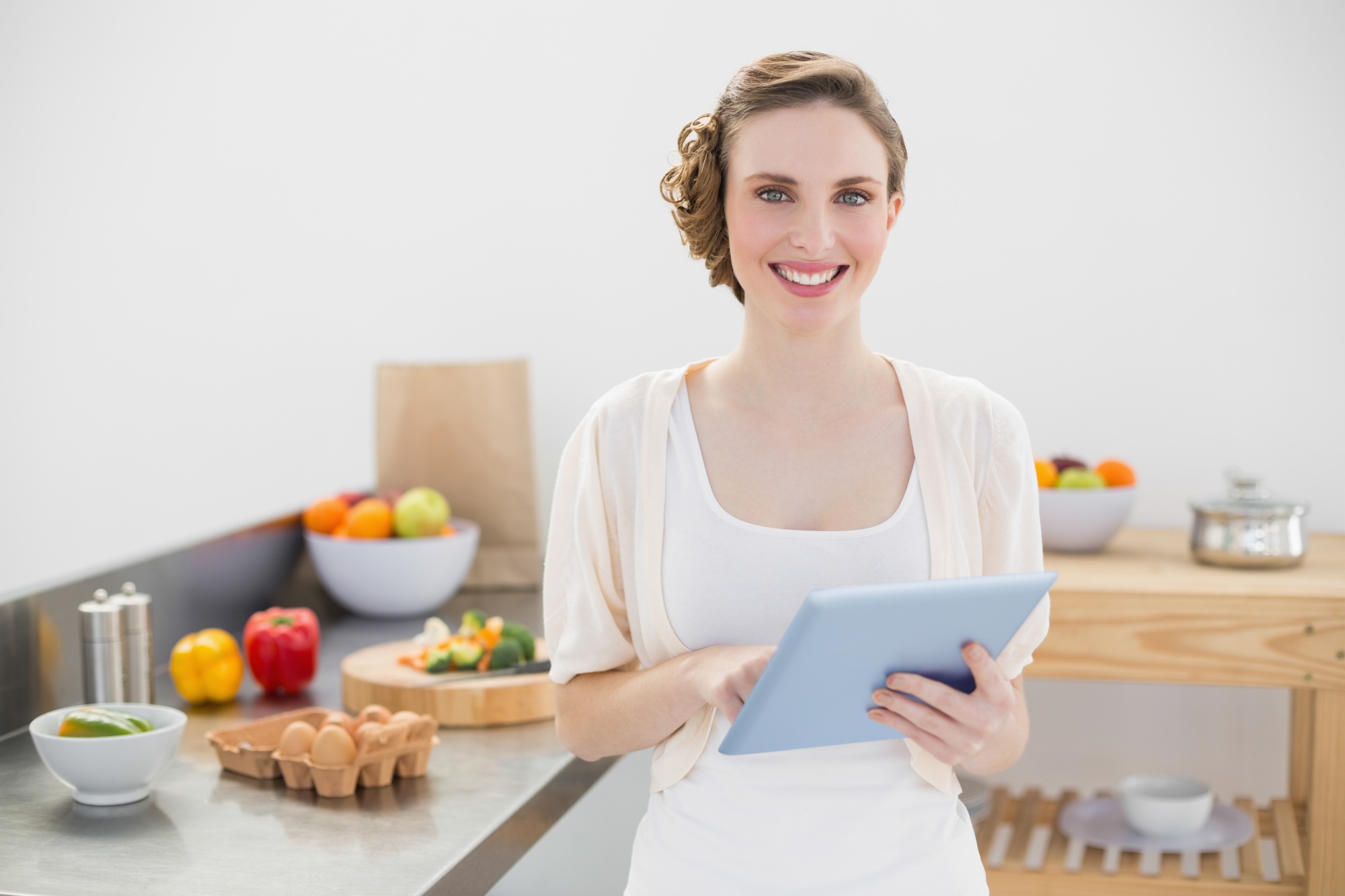 Instructor consulting a student over a recipe
