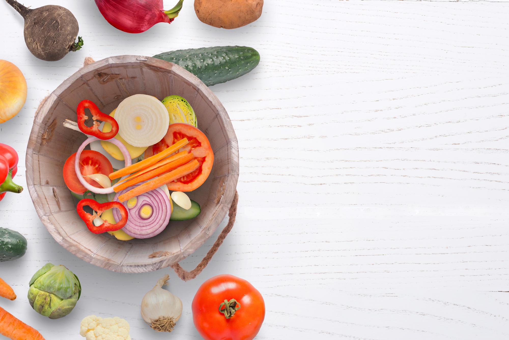 Bright vegetable bowl on a wooden table